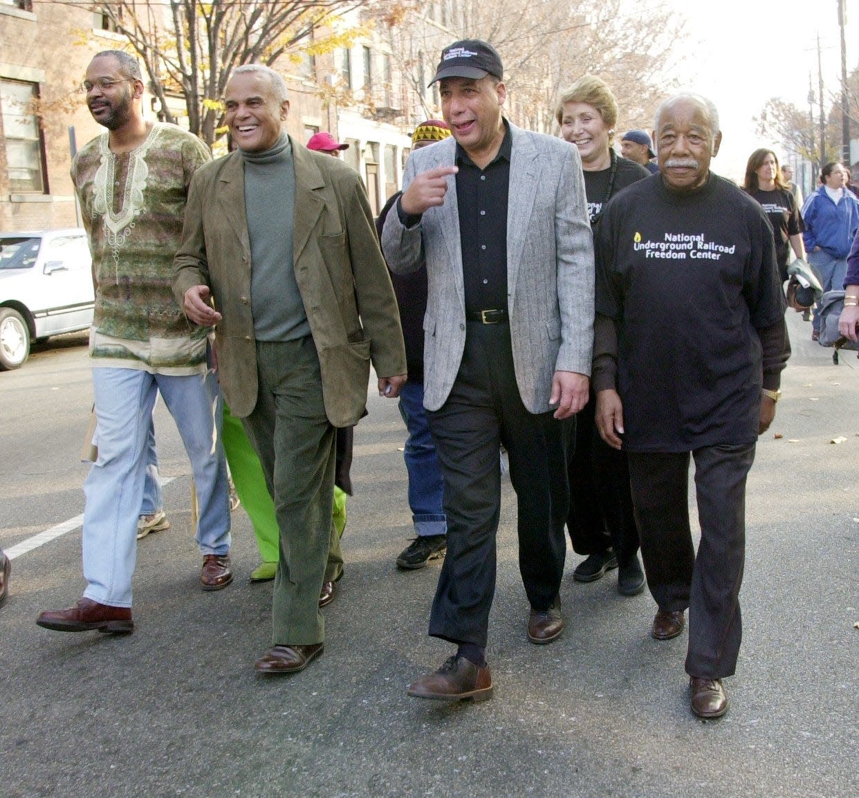 Entertainer and civil rights activist Harry Belafonte, who died Tuesday, toured Over-the-Rhine as part of a peace walk, Nov. 17, 2001, months after the civil unrest. Pictured, from left: the Rev. Damon Lynch III, Harry Belafonte, Ed Rigaud and Frederick T. Suggs Sr.