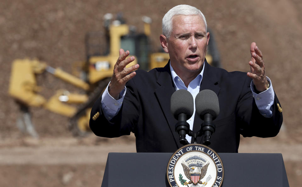 Vice President Mike Pence talks to the gathered employees of Caterpillar during a visit to the Tinaja Hills Demonstrations and Learning Center, Green Valley, Ariz., Thursday, Oct. 3, 2019. (Kelly Presnell/Arizona Daily Star via AP)