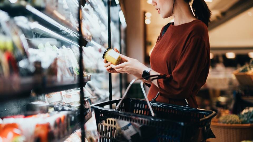 Woman checking food price