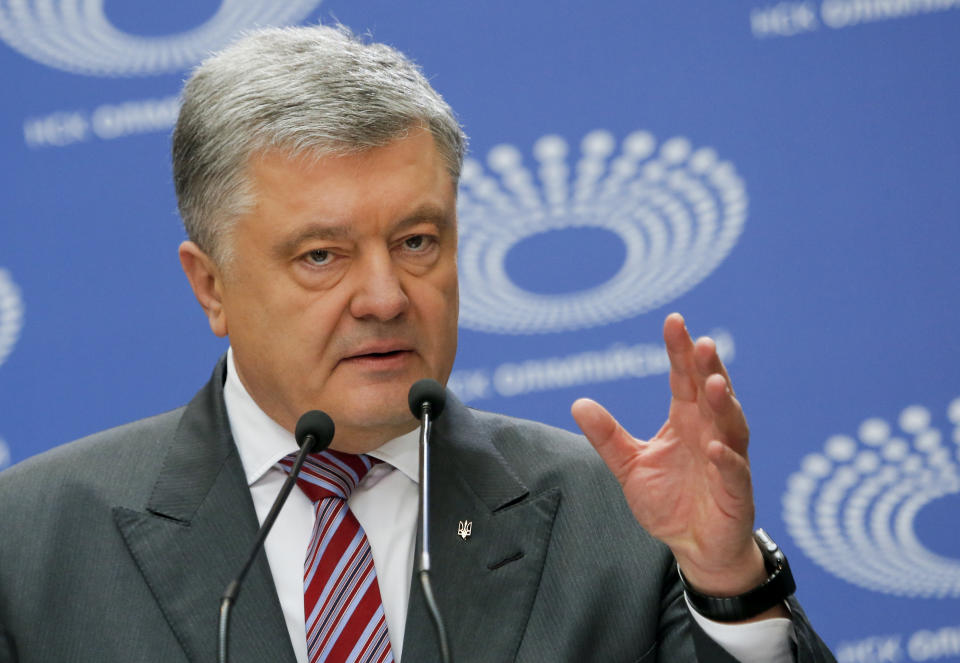 Ukrainian President Petro Poroshenko gestures as he answers to a journalist's question ahead of the presidential elections on April 21, at the Olympic stadium in Kiev, Ukraine, Sunday, April 14, 2019. (AP Photo/Efrem Lukatsky)