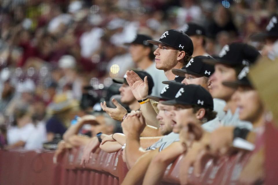 South Carolina players watch game action during an NCAA baseball game against NC State on Saturday, June 2, 2023, in Columbia, S.C. South Carolina won 6-3. South Carolina won 6-3. (AP Photo/Sean Rayford)