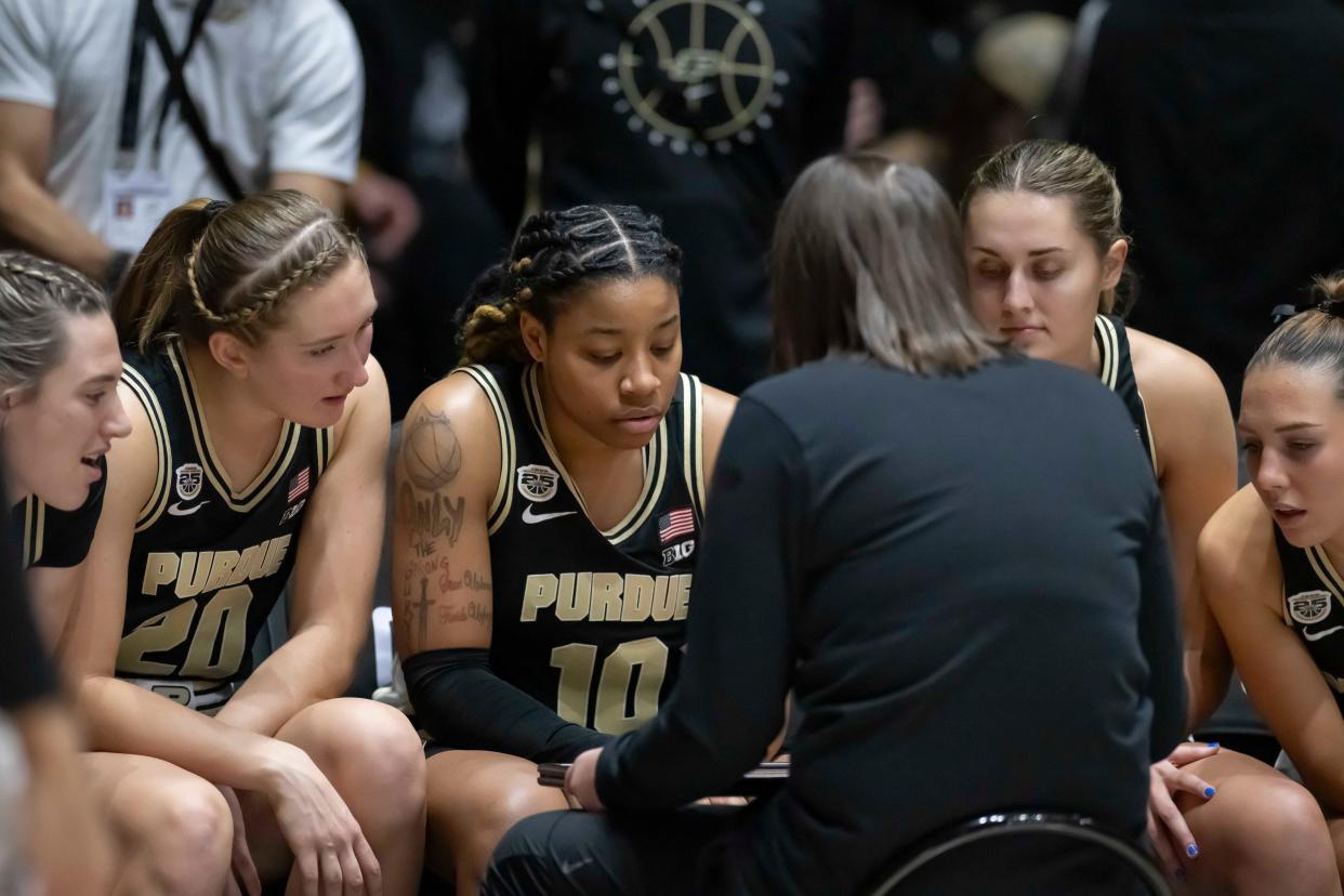 Boilers Head Coach Katie Gearlds huddles her starters before the NCAA women’s basketball game against the Indiana Hoosiers, Sunday Jan. 21, 2024, at Mackey Arena in West Lafayette, Ind. Indiana won 74-68.