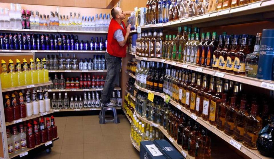 A clerk stocks shelves at an ABC liquor store in North Carolina.