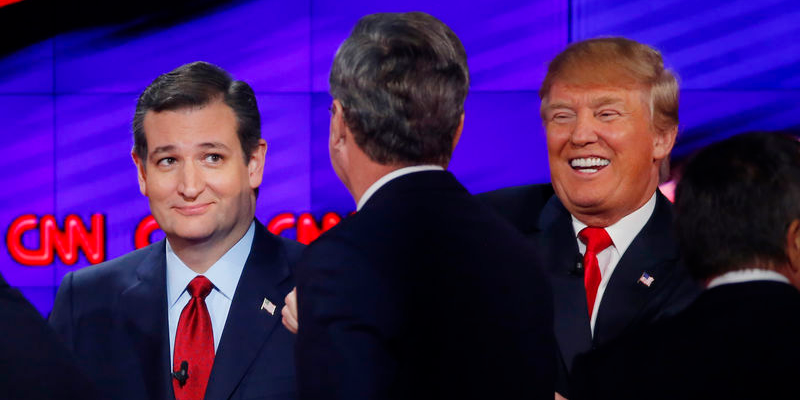 Ted Cruz, Jeb Bush and Donald Trump talk at the end of the debate. REUTERS/Mike Blake