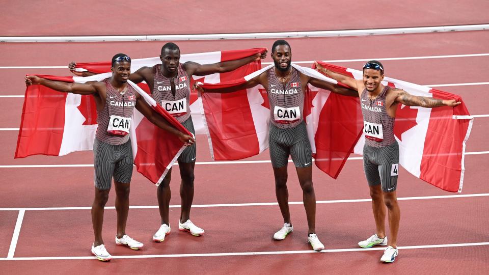 TOKYO, JAPAN - AUGUST 05: Aaron Brown, Jerome Blake, Brendon Rodney, and Andre De Grasse of team Canada celebrate after the men's 4x100m relay final during the Tokyo 2020 Olympic Games at Olympic Stadium in Tokyo, Japan on August 06, 2021. (Photo by Mustafa Yalcin/Anadolu Agency via Getty Images)