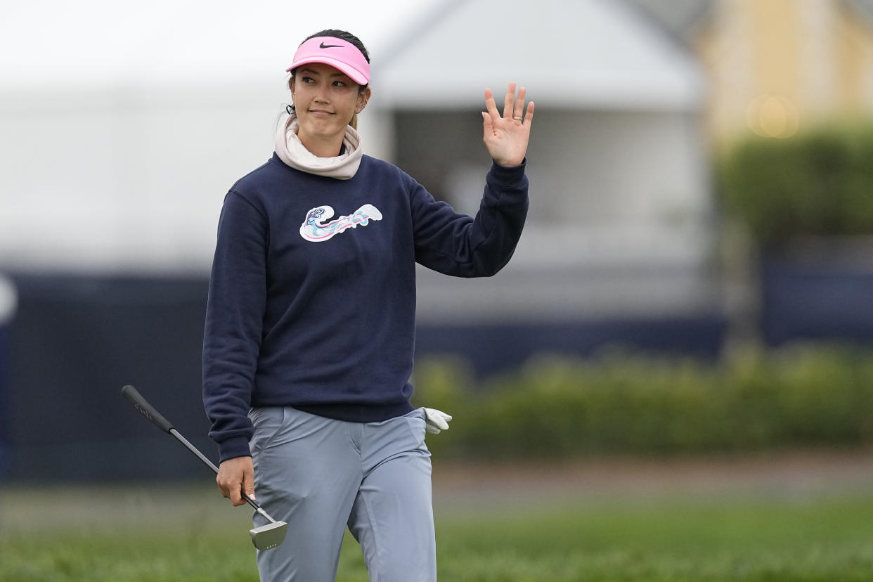 Michelle Wie West waves to the gallery during the second round of the U.S. Women's Open golf tournament at the Pebble Beach Golf Links, Friday, July 7, 2023, in Pebble Beach, Calif. (AP Photo/Darron Cummings)