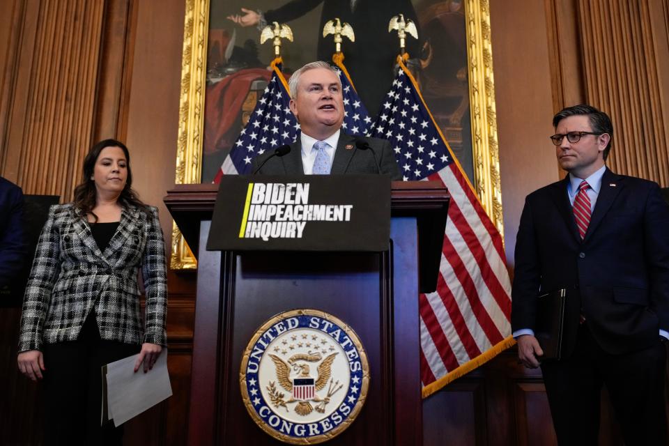 Flanked by, L-R, Rep. Elise Stefanik (R-NY) and U.S. Speaker of the House Mike Johnson (R-LA), Rep. James Comer (R-KY) speaks during a news conference with House Republican leadership at the U.S. Capitol November 29, 2023 in Washington, DC.