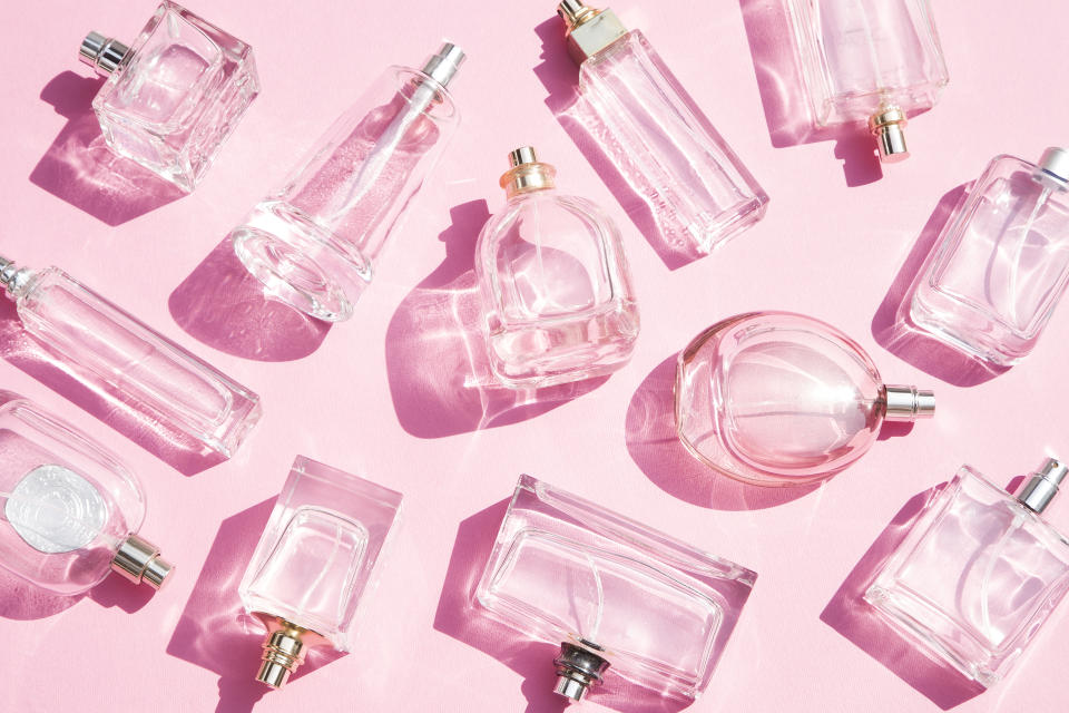 Perfume bottles on pink background