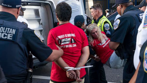 PHOTO: Climate activists are arrested after trying to get inside the stadium during a protest outside Nationals Park, where the annual Congressional Baseball Game for Charity is being held in Washington, July 28, 2022. (Jose Luis Magana/AP)