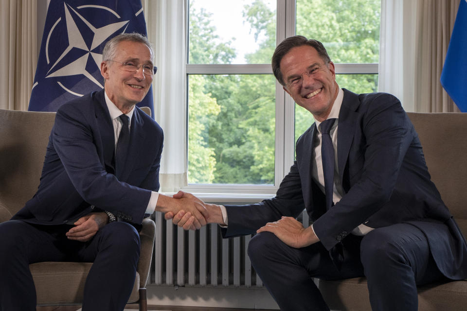 FILE - NATO Secretary General Jens Stoltenberg, left, and Dutch Prime Minister Mark Rutte shake hands for the cameras prior to a meeting in The Hague, Netherlands, Tuesday, June 27, 2023. NATO on Wednesday, June 26, 2024 appointed Mark Rutte as its next secretary-general, putting the outgoing Dutch prime minister in charge of the world's biggest security organization at a critical time for European security as war rages in Ukraine. (AP Photo/Peter Dejong, File)