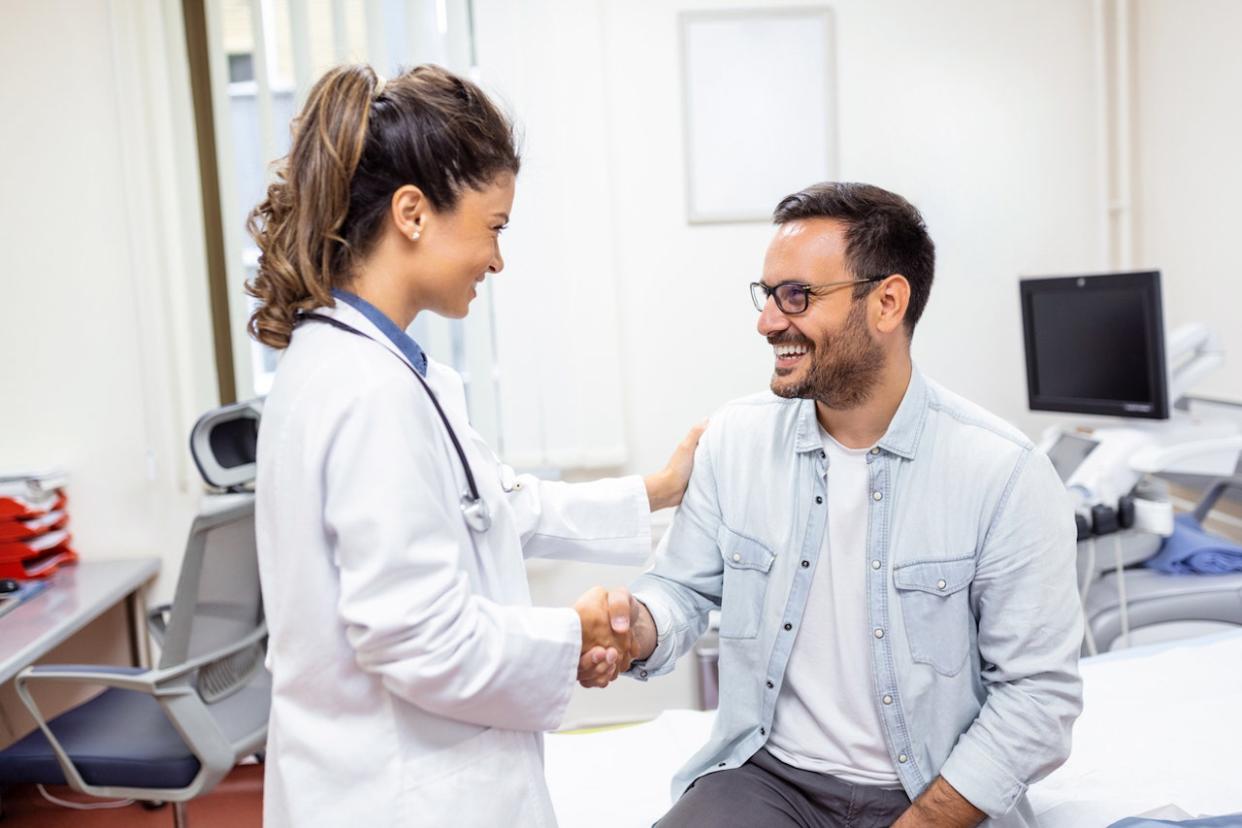 Female doctor with male patient