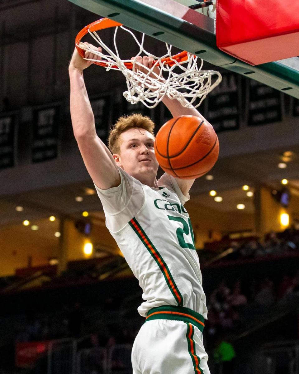 University of Miami forward Sam Waardenburg (21) dunks the ball during the first half of an NCAA basketball game against the University of North Carolina at the Watsco Center in Coral Gables, Florida, on Tuesday, January 18, 2022.