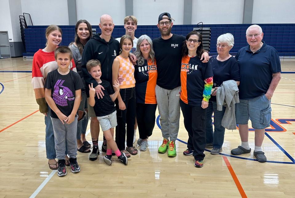 COS basketball coach Dallas Jensen's family pose for a photo; pictured, left from right: Aaliyah (daughter), Houston (nephew), Kimberlee (wife), Otis (son), Palmer (daughter), Zander (son), Cherie (mom), Derek (brother), Skye (aunt), Barbara (grandma) and Jay (grandpa).