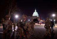 <p>Members of the US National Guard deploy around the US Capitol on January 12, 2021 in Washington, DC.</p>