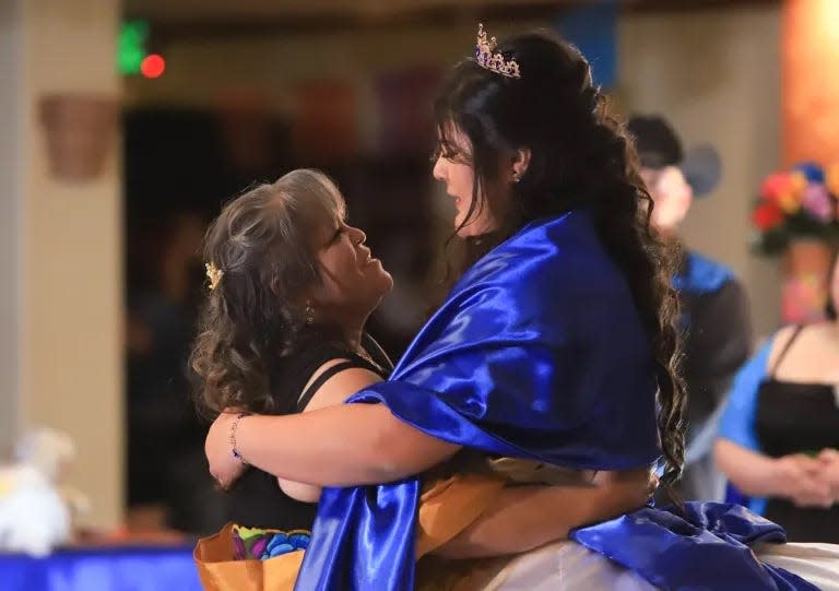 Karina shares an intimate moment during a dance with her grandmother, María García.