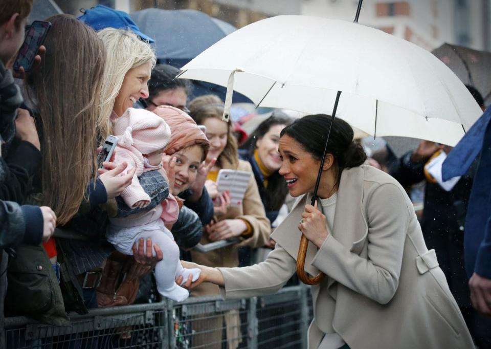 March 2018: Meghan Markle greets well-wishers after a visit to one of Belfast's most historic buildings, The Crown Liquor Saloon, a former Victorian gin palace, now run by the National Trust. It was the Royal couple's first joint visit to Northern Ireland (AFP via Getty)