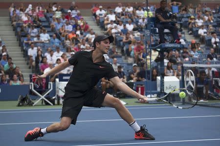 Adrian Mannarino of France returns a shot to Andy Murray of Britain during their second round match at the U.S. Open Championships tennis tournament in New York, September 3, 2015. REUTERS/Adrees Latif