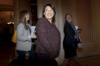 Sen. Amy Klobuchar, D-Minn., center, walks outside the Senate chamber during a break in the impeachment trial of President Donald Trump on charges of abuse of power and obstruction of Congress, at the Capitol in Washington, Wednesday, Jan. 22, 2020. (AP Photo/Julio Cortez)