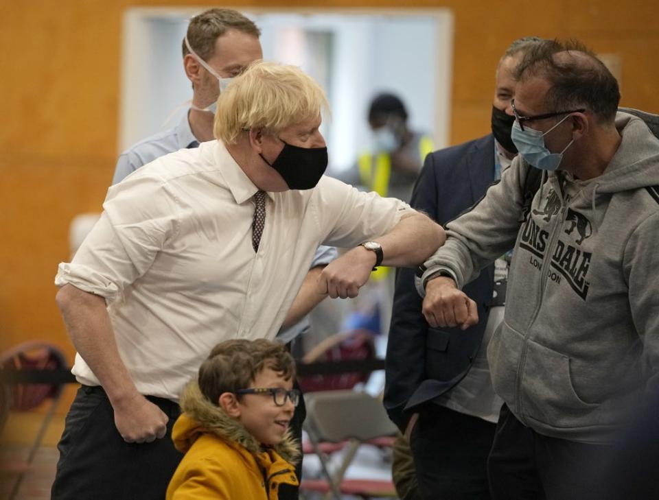 Boris Johnson, wearing a mask, during a visit to a vaccination centre in Little Venice, west London  (PA Wire)