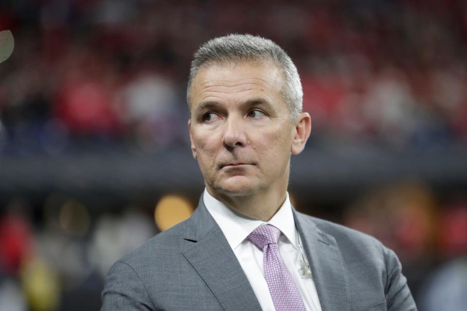 Former Ohio State head coach Urban Meyer watches during the second half of the Big Ten championship NCAA college football game between Ohio State and Wisconsin, Saturday, Dec. 7, 2019, in Indianapolis. (AP Photo/Michael Conroy)