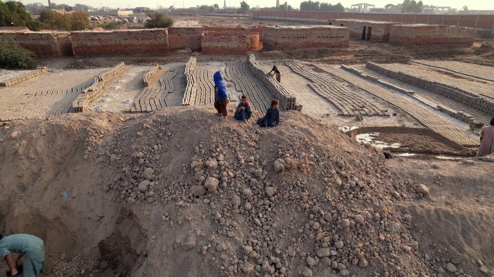 Bricks being laid in brick kiln