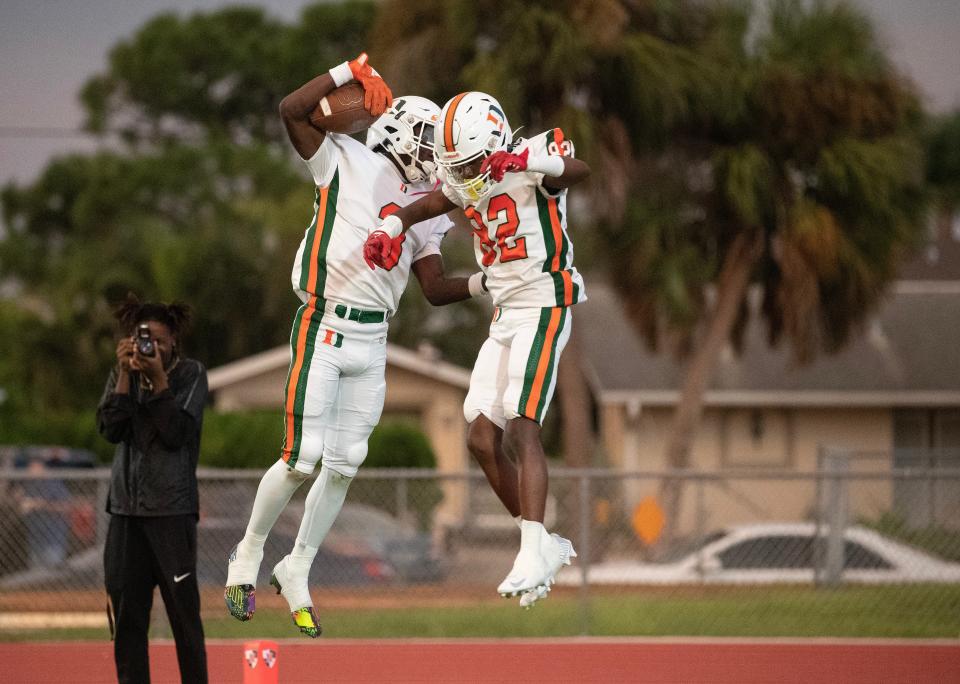 Eric Fletcher and Travaris Schley of Dunbar celebrate Fletcher's touchdown against North Fort Myers on Friday, Sept 1, 2023, in North Fort Myers.