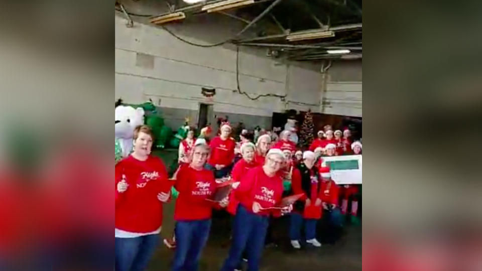 The cancer patients were greeted by a group in Christmas costumes. Source: Facebook/Flight to the North Pole