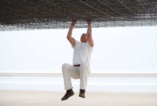 Antony Gormley poses with his installation Matrix III (2019) 