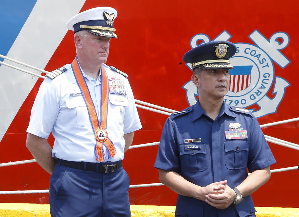 Captain John Driscoll, left, commanding officer of the U.S. Coast Guard National Security Cutter Bertholf (WMSL 750), and Philippine Coast Guard Spokesman Commander Armand Balilo, talk to the media during a port call by the U.S. cutter Wednesday, May 15, 2019 in Manila, Philippines. Capt. Driscoll told reporters that two Chinese Coast Guard ships were spotted off the South China Sea while they were conducting a joint exercise with Philippine Coast Guard. (AP Photo/Bullit Marquez)