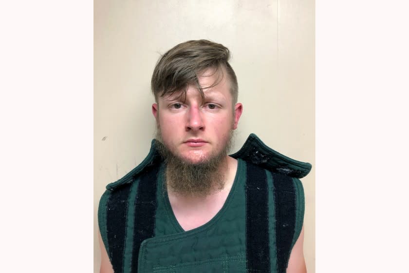 This booking photo provided by the Crisp County Sheriff's Office shows Robert Aaron Long on Tuesday, March 16, 2021. Long was arrested as a suspect in the fatal shootings of multiple people at three Atlanta-area massage parlors, most of them women of Asian descent, authorities said. (Crisp County Sheriff's Office via AP)