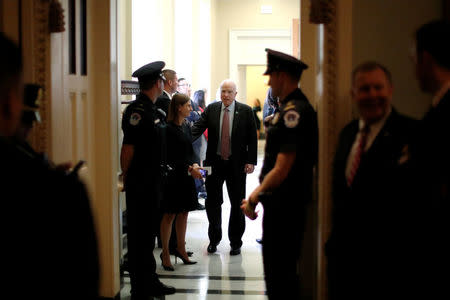 U.S. Senator John McCain (R-AZ) (C) departs after the weekly Republican caucus policy luncheon at the U.S. Capitol in Washington, U.S. September 19, 2017. REUTERS/Jonathan Ernst