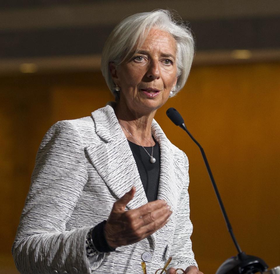 International Monetary Fund (IMF) Managing Director Christine LaGarde makes a statement about sanctions leveled against Russia, during a news conference following an IMF Executive Board meeting at IMF Headquarters in Washington, Wednesday, April 30, 2014. LaGarde announced that the IMF board has approved a two-year, $17 billion loan package for Ukraine. (AP Photo/Cliff Owen)