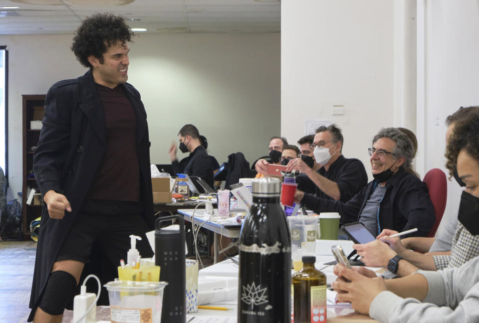 Director Tony Taccone, right, laughs while watching actor Joel Perez rehearse a scene for the musical comedy “Kiss My Aztec!” in Hartford, Conn,, on May 12, 2022. The show, co-written by John Leguizamo and Taccone, will be playing at the Hartford Stage from June 1 to June 26. (Alan Arias via AP)