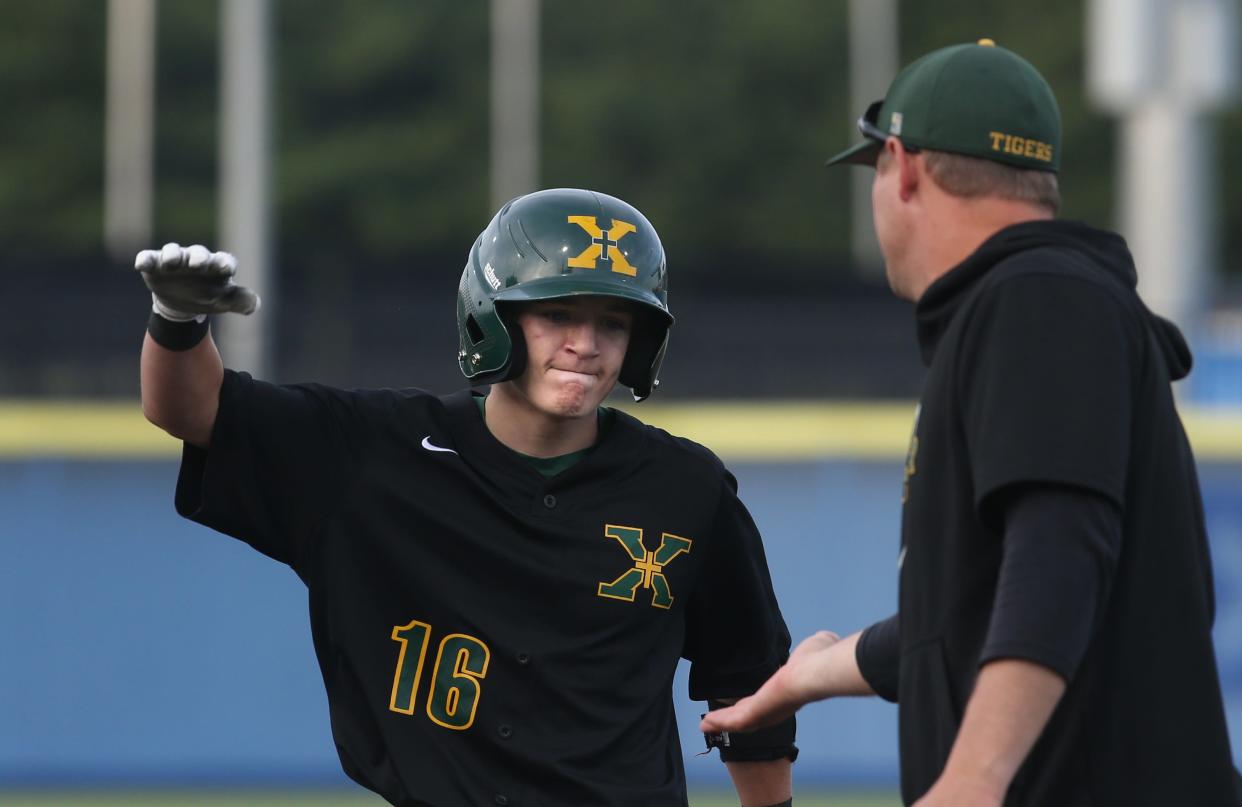 St. X’s Ryan Comella hits a single against Russell County.June 11, 2022