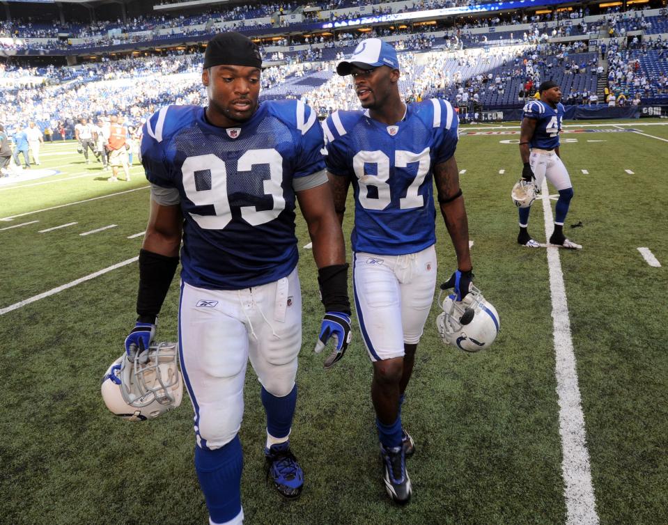 Indianapolis Colts Dwight Freeney,left, and Reggie Wayne,right, walk off the field following their win over the Jacksonville Jaguars Sunday, September 13, 2009, afternoon at Lucas Oil Stadium. 