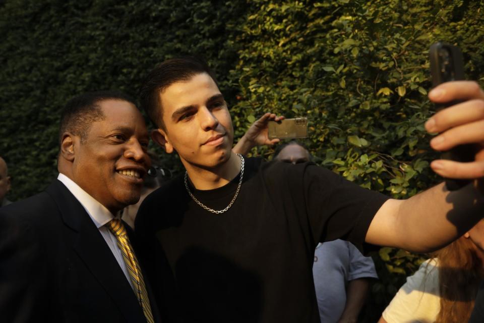 Larry Elder poses for a selfie.