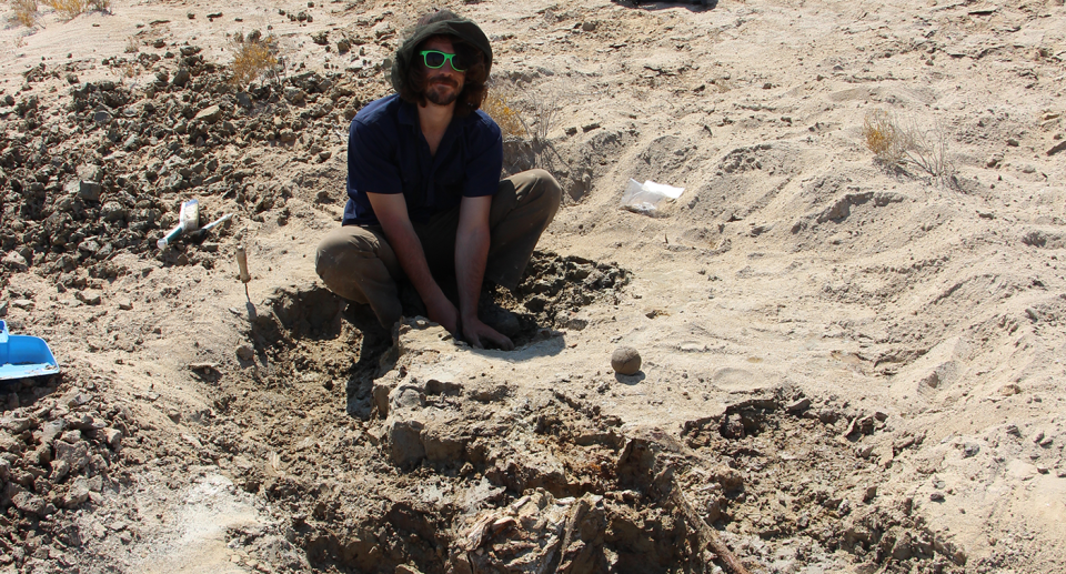 Dr Isaac Kerr examining ancient remains at Lake Callabonna. Source: Flinders University