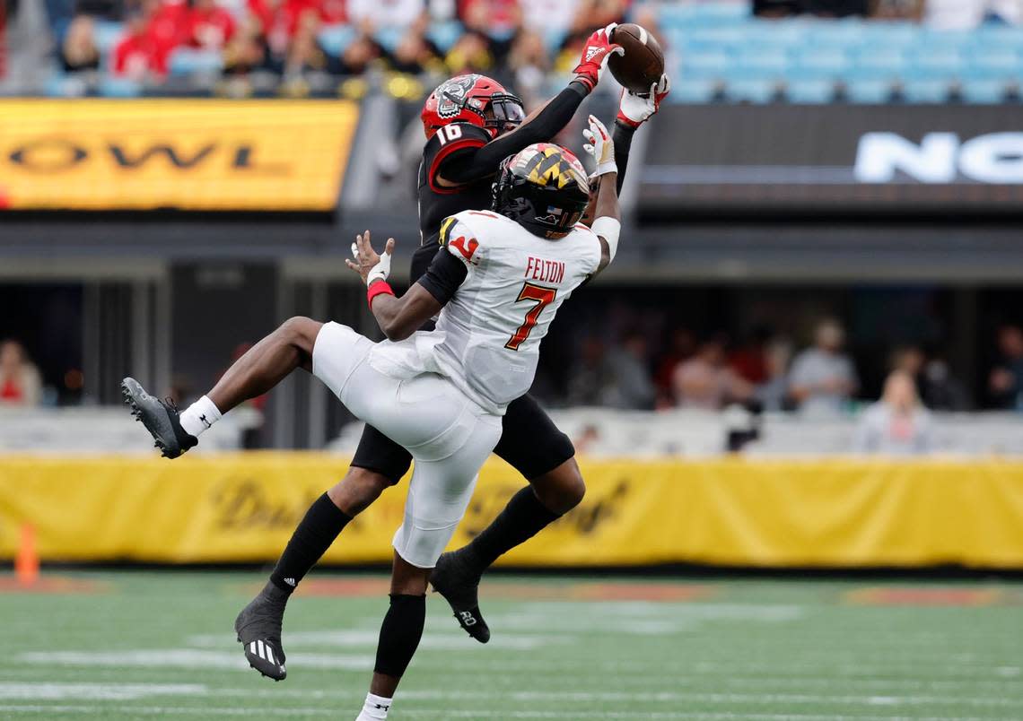 N.C. State safety Rakeim Ashford (16) intercepts the ball intended for Maryland wide receiver Dontay Demus Jr. (7) during the second half of Maryland’s 16-12 victory over N.C. State in the Duke’s Mayo Bowl at Bank of America Stadium in Charlotte, N.C., Friday, Dec. 30, 2022.