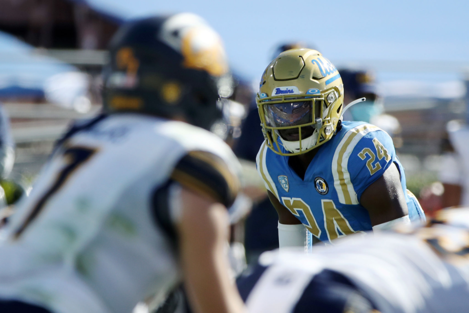 UCLA's Qwuantrezz Knight looks at California's Chase Garbers during a game