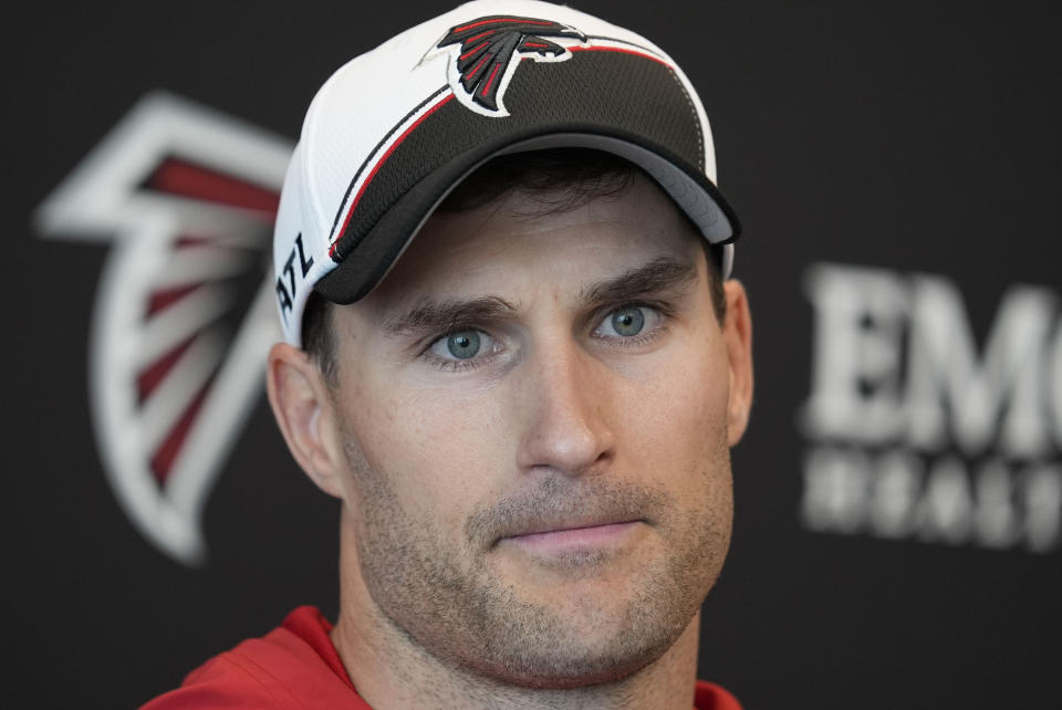 FILE - Atlanta Falcons quarterback Kirk Cousins speaks during a news conference after an NFL football practice Tuesday, May 14, 2024, in Flowery Branch, Ga. The Atlanta Falcons were stripped of a fifth-round pick in next year's draft on Thursday, June 13, for violating the NFL’s anti-tampering rules prior to signing quarterback Kirk Cousins.(AP Photo/Brynn Anderson, File)