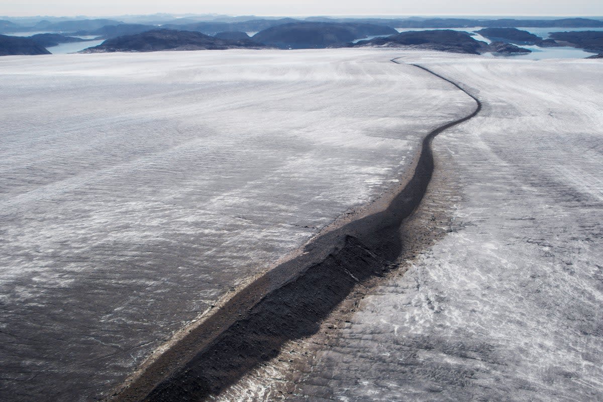 A melting glacier showing the rock hidden for millennia beneath the ice in south west Greenland (Getty Images/iStockphoto)