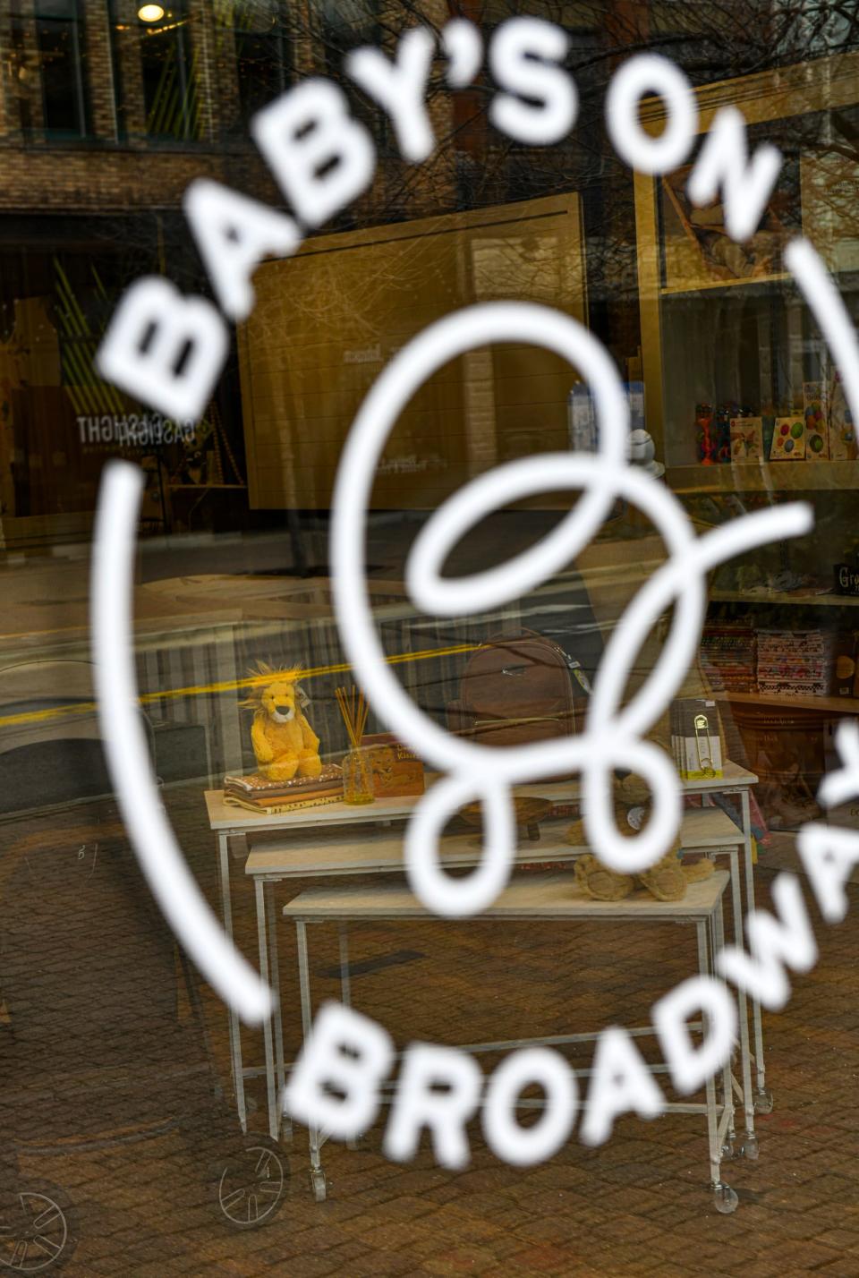 A lion toy is visible near the entrance Tuesday, April 26, 2022, at Baby's on Broadway in downtown St. Cloud.