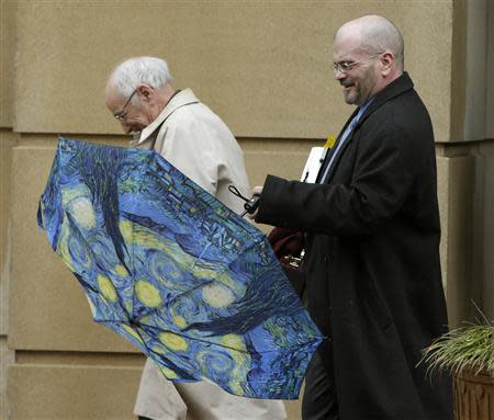 Attorney Thomas Wayne Biggs (R), who represented Martha Fuqua, departs the U.S. District Court in Alexandria, Virginia January 10, 2014. REUTERS/Gary Cameron