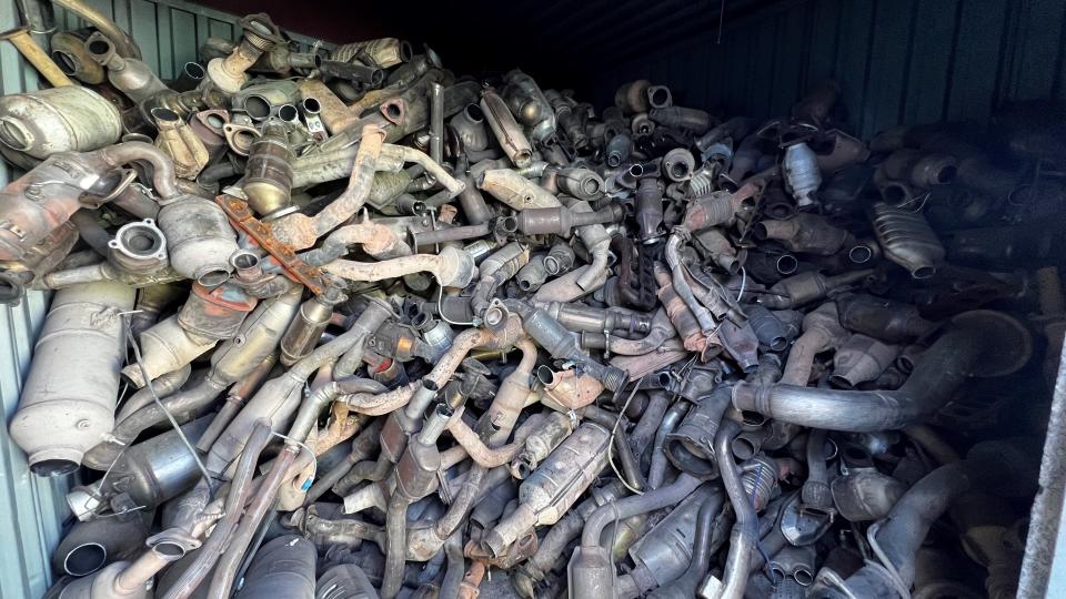 This photo provided by the Phoenix Police Department shows stolen catalytic converters that were recovered after detectives served a search warrant at a storage unit in Phoenix on Thursday, May 27, 2022. The bust came amid a national surge in thefts of the pricy auto parts that play a critical in reducing vehicle emissions and has led lawmakers in 36 states and in Washington D.C. to consider new laws to address the problem. (Phoenix Police Department via AP)