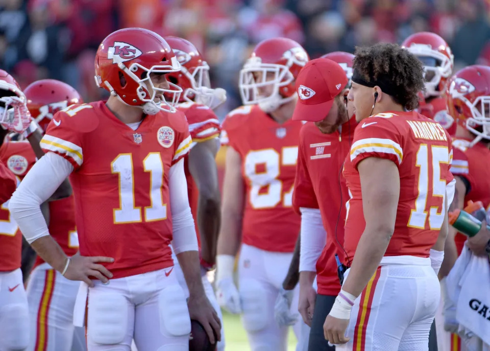 Dec 10, 2017; Kansas City, MO, USA; Kansas City Chiefs quarterback Alex Smith (11) talks with quarterback Patrick Mahomes (15) during the first half against the Oakland Raiders at Arrowhead Stadium. Mandatory Credit: Denny Medley-USA TODAY Sports