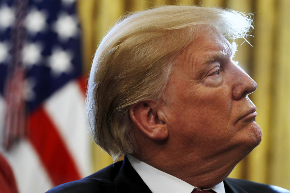 President Donald Trump listens during a meeting with American manufacturers in the Oval Office of the White House, Thursday, Jan. 31, 2019, in Washington. (AP Photo/Jacquelyn Martin)