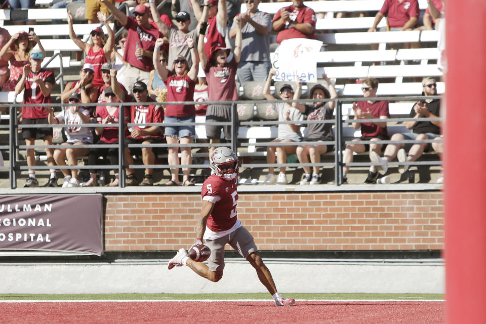 Washington State wide receiver Lincoln Victor runs for a touchdown during the first half of an NCAA college football game against Northern Colorado, Saturday, Sept. 16, 2023, in Pullman, Wash. (AP Photo/Young Kwak)