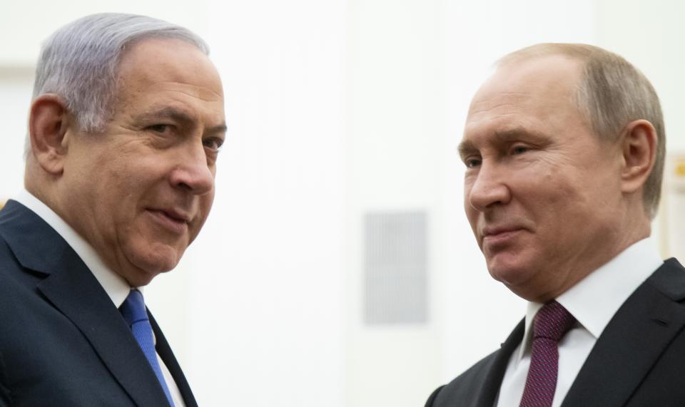 Russian President Vladimir Putin, right, and Israeli Prime Minister Benjamin Netanyahu pose for a photo during their meeting in the Kremlin in Moscow, Russia, Thursday, April 4, 2019. (AP Photo/Alexander Zemlianichenko, Pool)