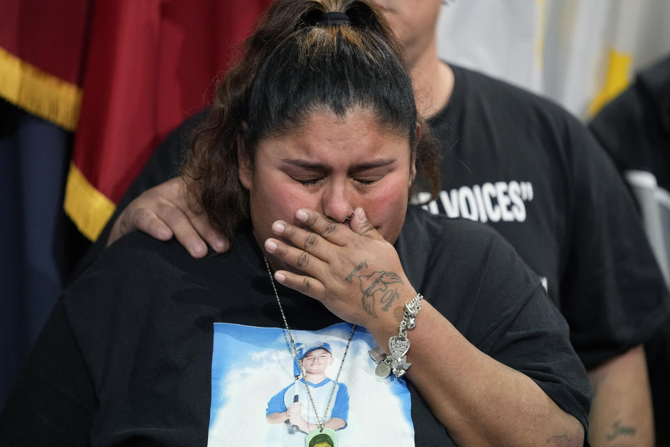 FILE - Felicia Martinez, mother of Xavier Lopez who was killed by a gunman at Robb Elementary School in Uvalde, Texas, tries to hold back tears after speaking at a news conference at the Texas Capitol with Texas State Sen. Roland Gutierrez, in Austin, Texas, on Jan. 24, 2023. Gutierrez says he is filing legislation in the wake of Texas' rising gun violence. (AP Photo/Eric Gay, File)