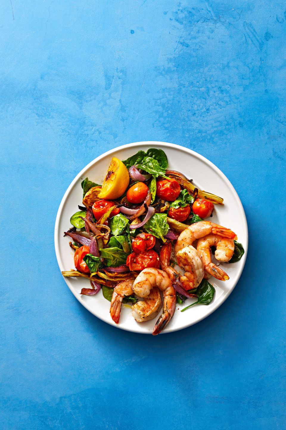 healthy roast shrimp and salad on a plate